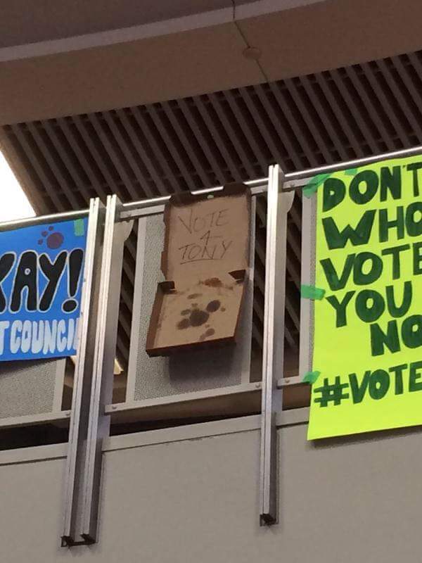 A pizza box as a poster in high school election - meme