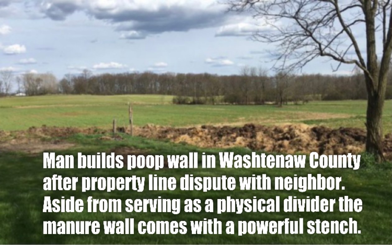 The farmer who built the structure denies it is a poop wall he says it is a compost divider. - meme