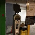 This is a solar powered parking metre, in a parking building