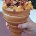 bread cone stuffed with mac and cheese with caramelized bacon
