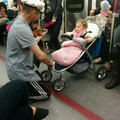 Man playing his violin for a baby