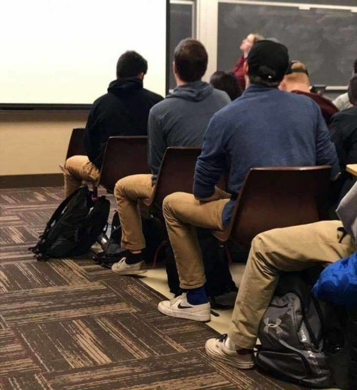 Meeting of the "Jake from State Farm" clones wearing their required  khaki pants. - meme