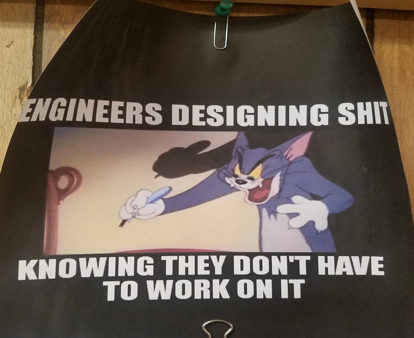 Hung up in job trailer above blueprints - meme
